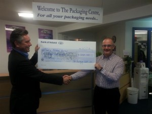 Ivan Powell presents the donation to Noel O'Connell
